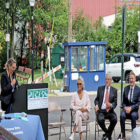 DRBC's Kristen Bowman Kavanagh (at podium) welcomes everyone to the Delaware River Waterfront in Trenton, N.J. Photo by the DRBC.