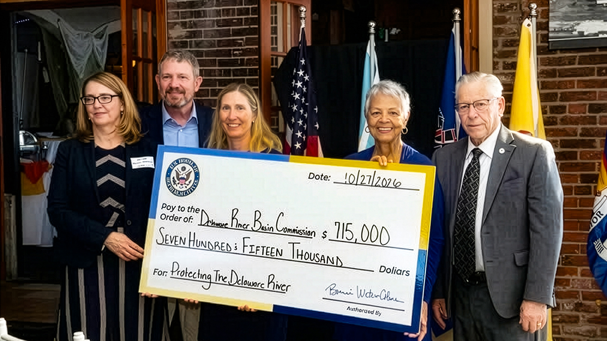 From L: DRBC ED Kristen Bowman Kavanagh, N.J. Alt. Commissioner Steve Domber, DRBC Dir. External Affairs Beth Brown, Rep. Bonnie Watson Coleman and Ewing Twp. Mayor Bert H. Steinmann hold a large check. Photo courtesy of Rep. Bonnie Watson Coleman's office.