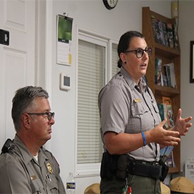 Standing: USACE Park Staff BriannaTreichler discusses the issue of harmful algal blooms & how they affect Blue Marsh Lake. Photo by the DRBC.