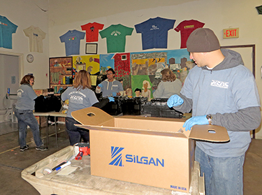 DRBC staff put together boxes of food for the food bank's Send Hunger Packing Program. Photo by DRBC.