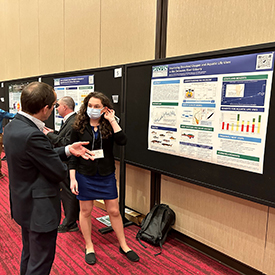 Dr. Sarah Beganskas talks with a Summit attendee about the DRBC's effort to improve dissolved oxygen in the Delaware River Estuary. Photo by the DRBC.