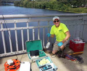 DRBC's Dr. Ron MacGillivray collects a water sample to monitor for PFCs. Photo by DRBC.
