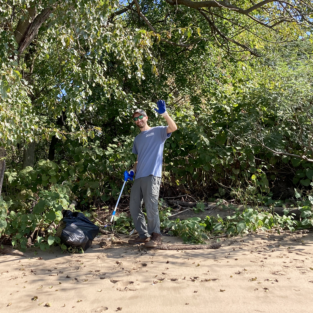 Lots of smaller trash gets caught up inthe greenery along the high tide line. DRBC's Jake Bransky is on it. Photo by the DRBC.
