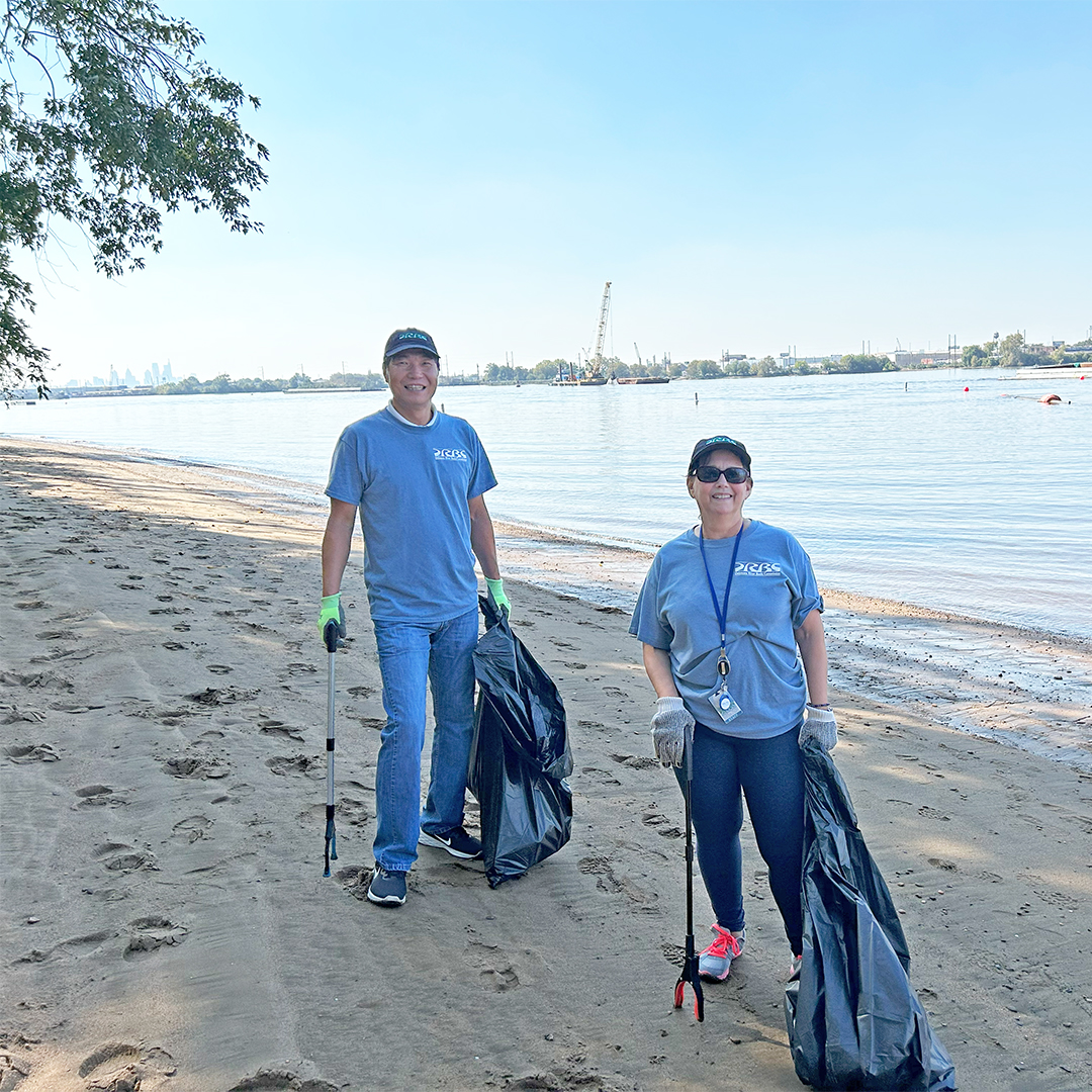 DRBC's Namsoo Suk (R) and Elba Deck pick up trash along the river. Photo by the DRBC.