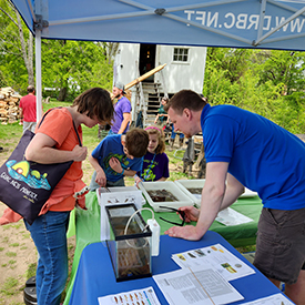 DRBC's Kyle McAllister talks aboutwhat bugs you find in the river. Photo by the DRBC.