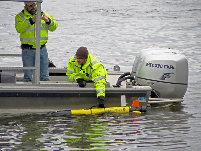 A UGSG staffer places the Ecomapper in the river to begin its data collection mission at Penn's Landing, Philadelphia, Pa. Photo by DRBC.