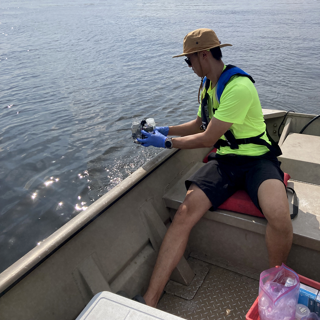 DRBC staff collects a water sample to monitor for bacteria. Photo by the DRBC.