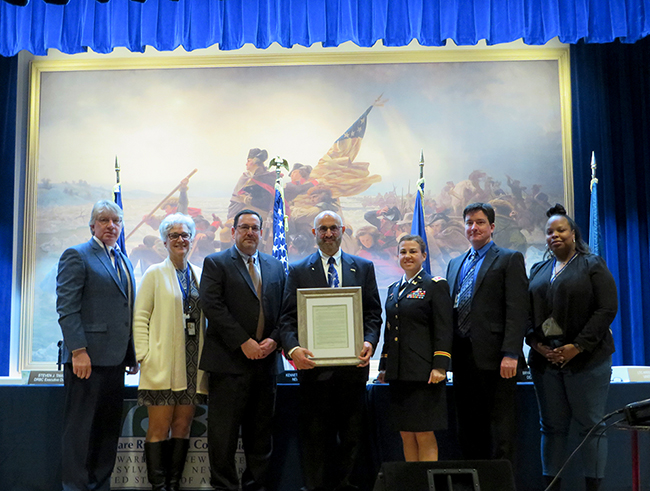 Michele Putnam (2nd from left) joins her fellow Commissioners to honor DRBC's Dr. Ken Najjar on his retirement, March 2019. Photo by DRBC.