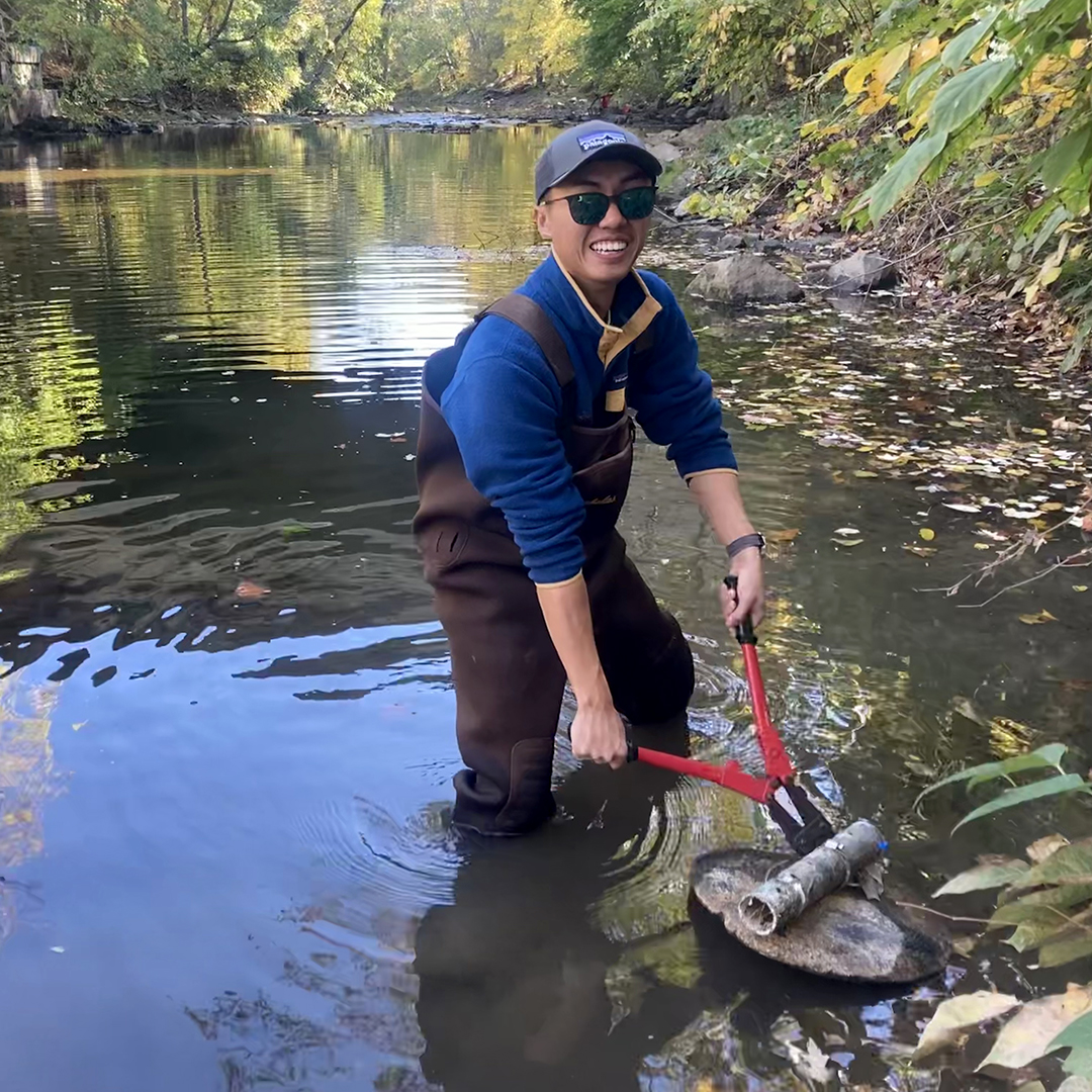 DRBC staff preps a continuous data logger at a Delaware River tributary. Photo by the DRBC.