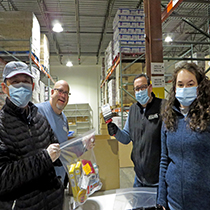 DRBC staff packs meals for local community members. Photo by the DRBC.