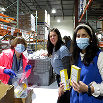 DRBC staff packs meals for local community members. Photo by the DRBC.