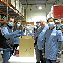 DRBC staff packs meals for local community members. Photo by the DRBC.