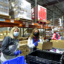 DRBC staff packs meals for local community members. Photo by the DRBC.