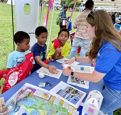 DRBC staff talk with local youth about baseball's connection to the Delaware River Basin. Photo by the DRBC.