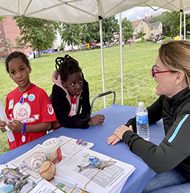 DRBC staff talks with local youth about the different fish you can find in the Delaware River. Photo by the DRBC.