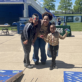 A family poses for a pic after playing baggo. Photo by the DRBC.