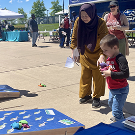 This young festival attendee had funwith our baggo boards. Photo by the DRBC.