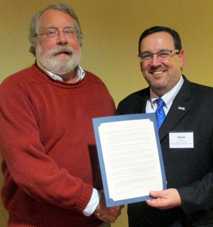 DRBC Executive Director Steve Tambini (right) presents a ceremonial resolution to Bob Molzhan (left) to congratulate him on his retirement. Photo courtesy of WRADRB member Dennis Palmer.