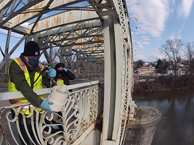 DRBC staff collect a water sample from the Schuylkill River to monitor nutrient levels. Photo by DRBC.
