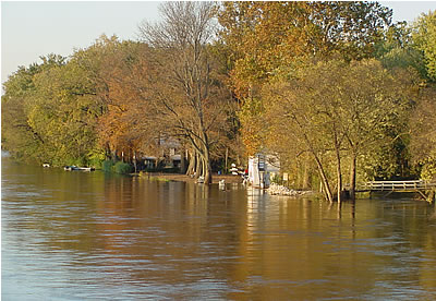 View of Lewis Island along the Delaware River in Lambertville, N.J. (4:33 p.m. on Oct. 30, 2003). The river has reached the small, white house used by the Lewis Shad Fishery Crew.