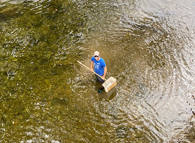 DRBC Aquatic Biologist Jake Bransky prepares to collect a macroinvertebrate sample, a biological indicator of water quality. Photo by DRBC.