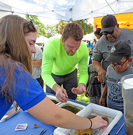 Kids (and adults) enjoyed the opportunity to check out the trays & see what they can find! Photo by the DRBC.