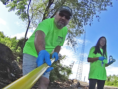 DRBC Mgr. of Water Quality Assessment John Yagecicand Water Quality Intern Daisy DePaz collect a surfacewater sample to monitor for bacteria levels in 2019. Photo by DRBC.