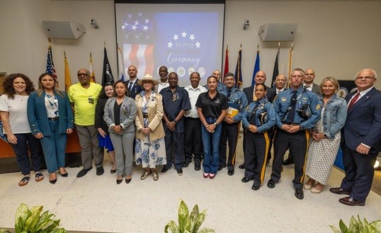 Group photo of Deputy Commissioner Esther Chucaralao and the 30 NJ Veteran Honorees at the State Medals Ceremony