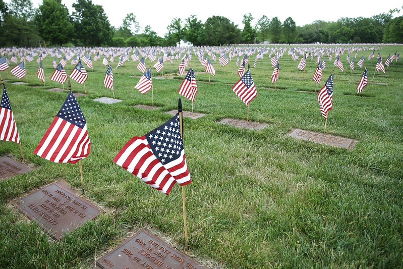 Graves with American flags placed at Brigadier General William C. Doyle Veterans Memorial Cemetery 