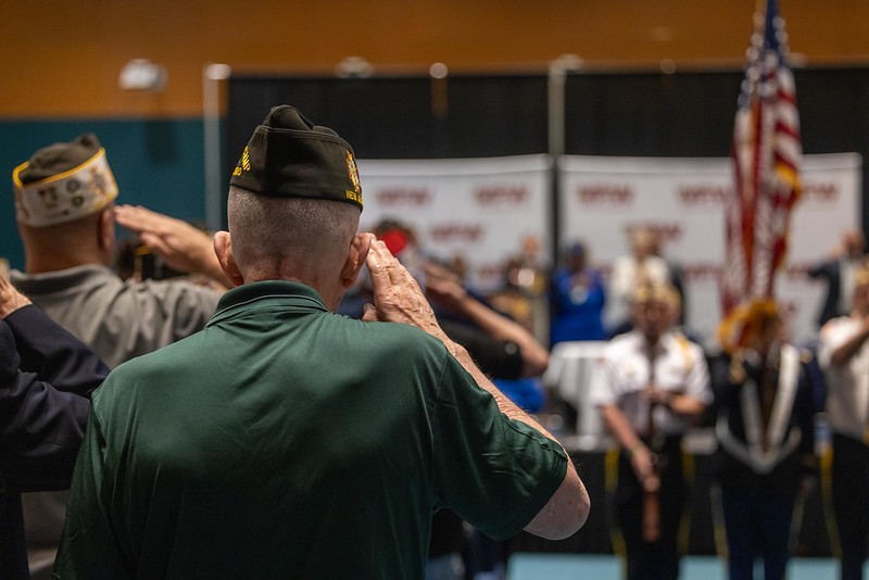 Veterans at the Veterans of Foreign Wars Department of New Jersey convention saluting during the playing of the national anthem. 