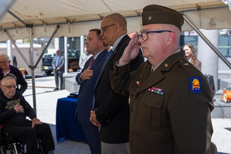 From left to right, Commissioner Vincent Solomeno, and Lieutenant Governor Dr. Dale Caldwell, .S. Army Brig. Gen. Arthur Roscoe pay their respects during the ceremony.