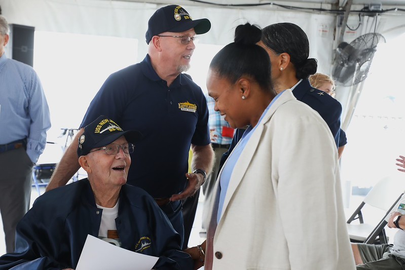 Deputy Commissioner Esther Chucaralao meeting Paul Robbins, the last known World War II plankowner veteran of the Battleship New Jersey.