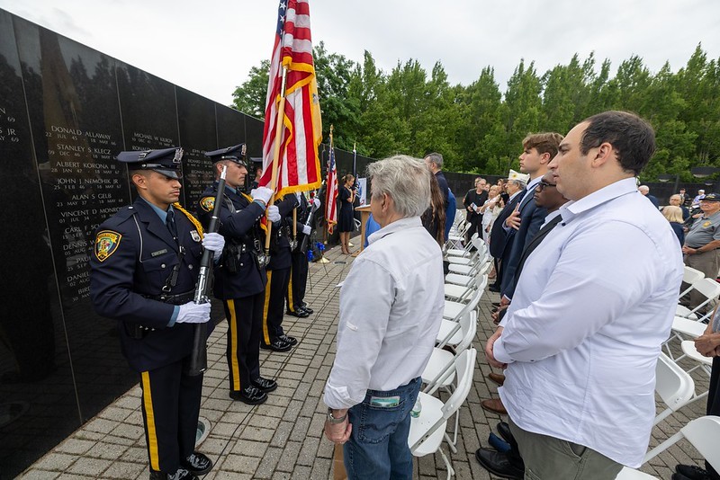 NJ State troopers lined in front of the memorial during speech at ceremony.