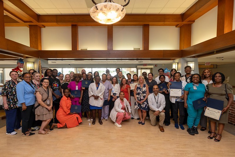 Group photo of Deputy Commissioner Esther Chucaralao, Deputy Commissioner of Veterans Affairs, and Menlo Park team members who received awards for their service.