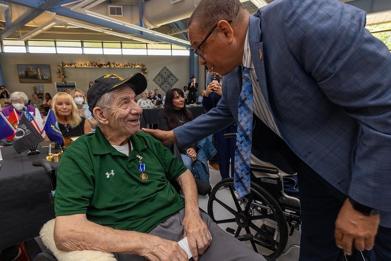 Lieutenant Governor Dr. Dale Caldwell with a State Medal recipient at the Paramus Veterans Home