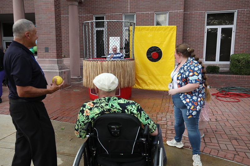 Vineland resident participates in a dunk tank contest at the home's end-of-summer luau.