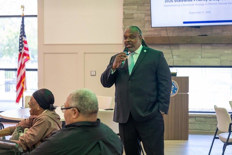 Rev. Dr. Samuel Hayes speaking with leaders at the NJ Governor's challenge Fall Summit at Cherry Blossom Welcome Center.