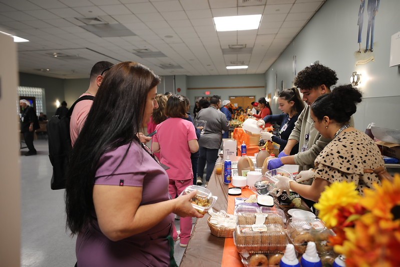 Staff serving harvest-themed food at the Vineland Veterans Home.