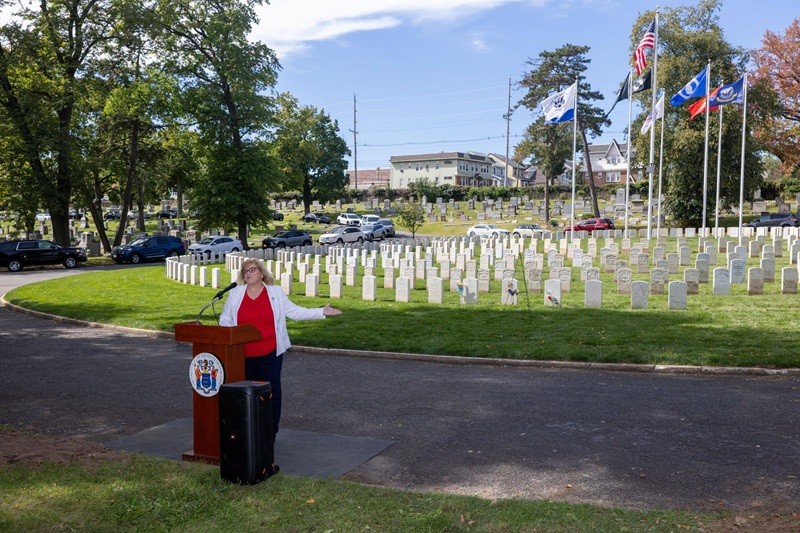 Doreen Van Horn-Bloomer, President of the Hudson County Genealogical and Historical Society, speaking at the rededication ceremony.