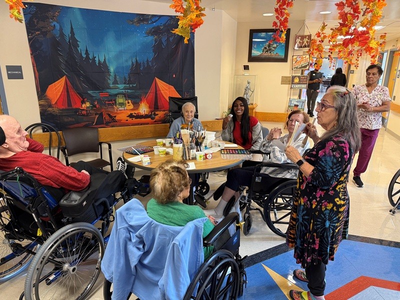 Art instructor Suzi Gerace of Dream Makers Art Studio instructing a watercolor painting class to veterans at the Paramus Veterans Memorial Home. 