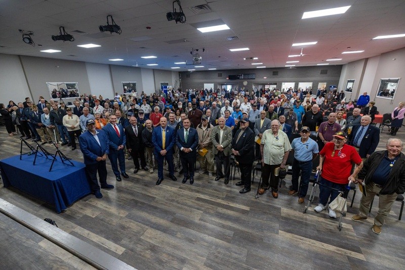 Commissioner Vincent Solomeno standing with a group of over 100 Veterans that were honored at the Toms River medal ceremony