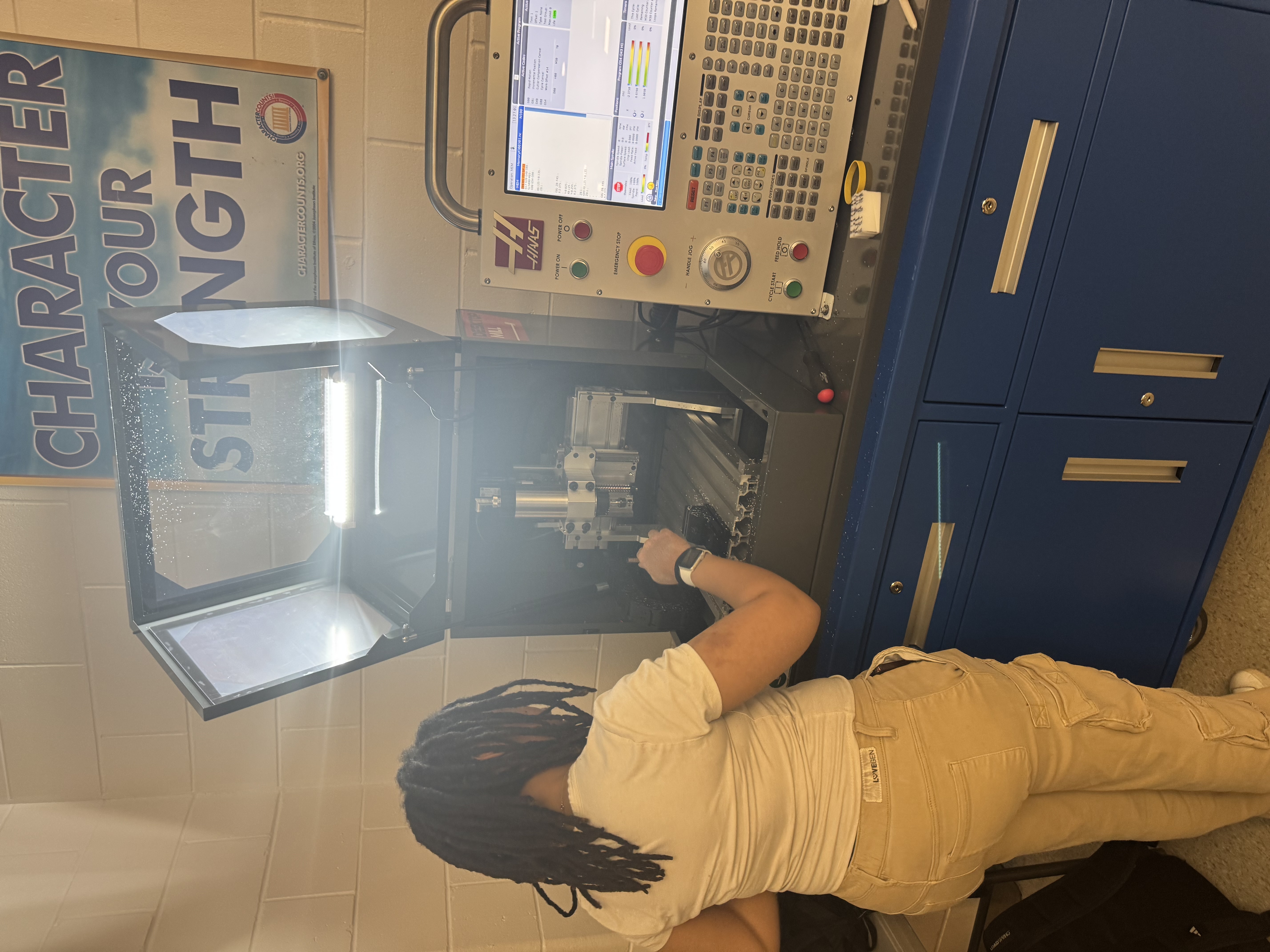 student with cnc machine