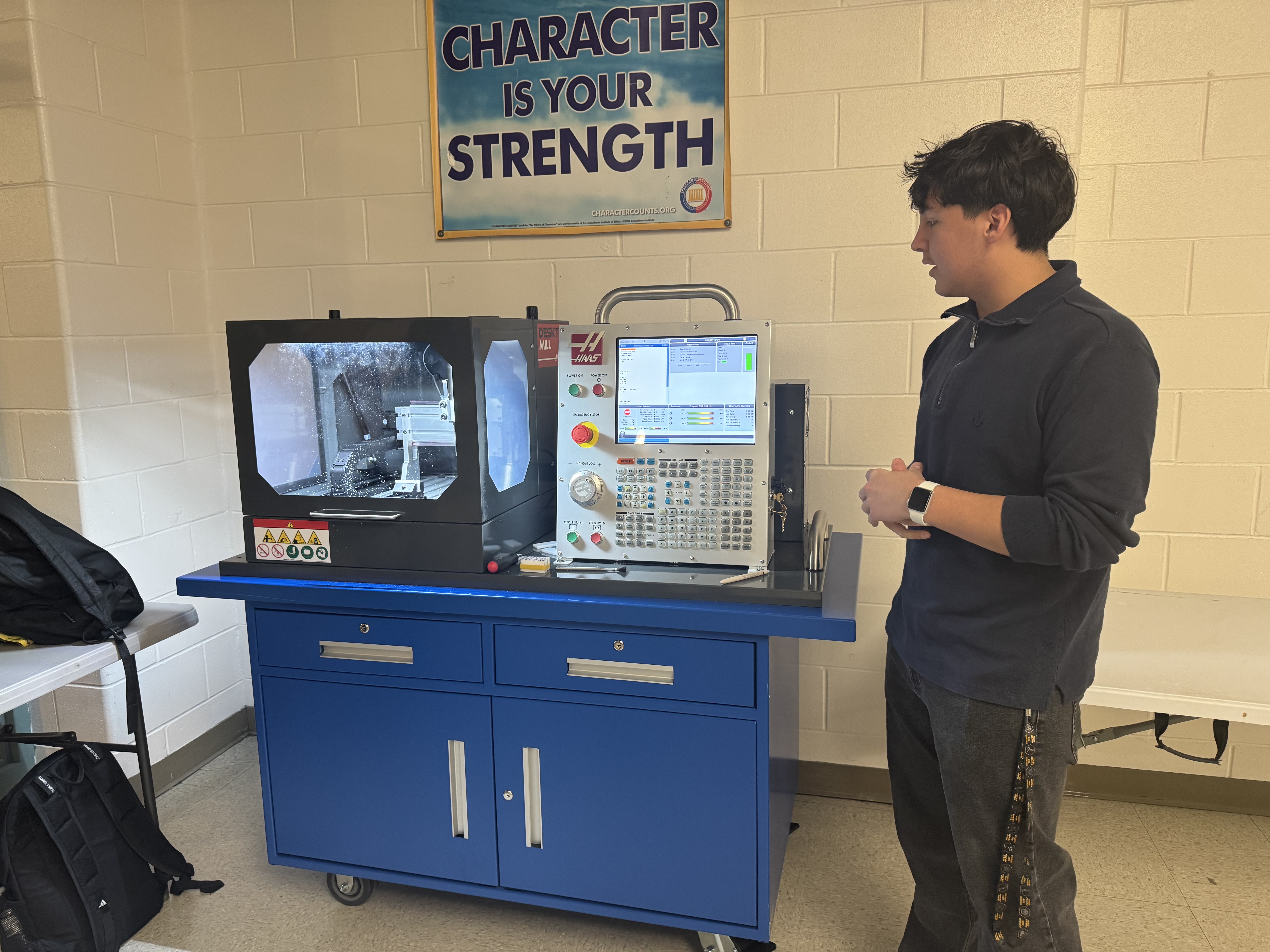 Student with CNC machine