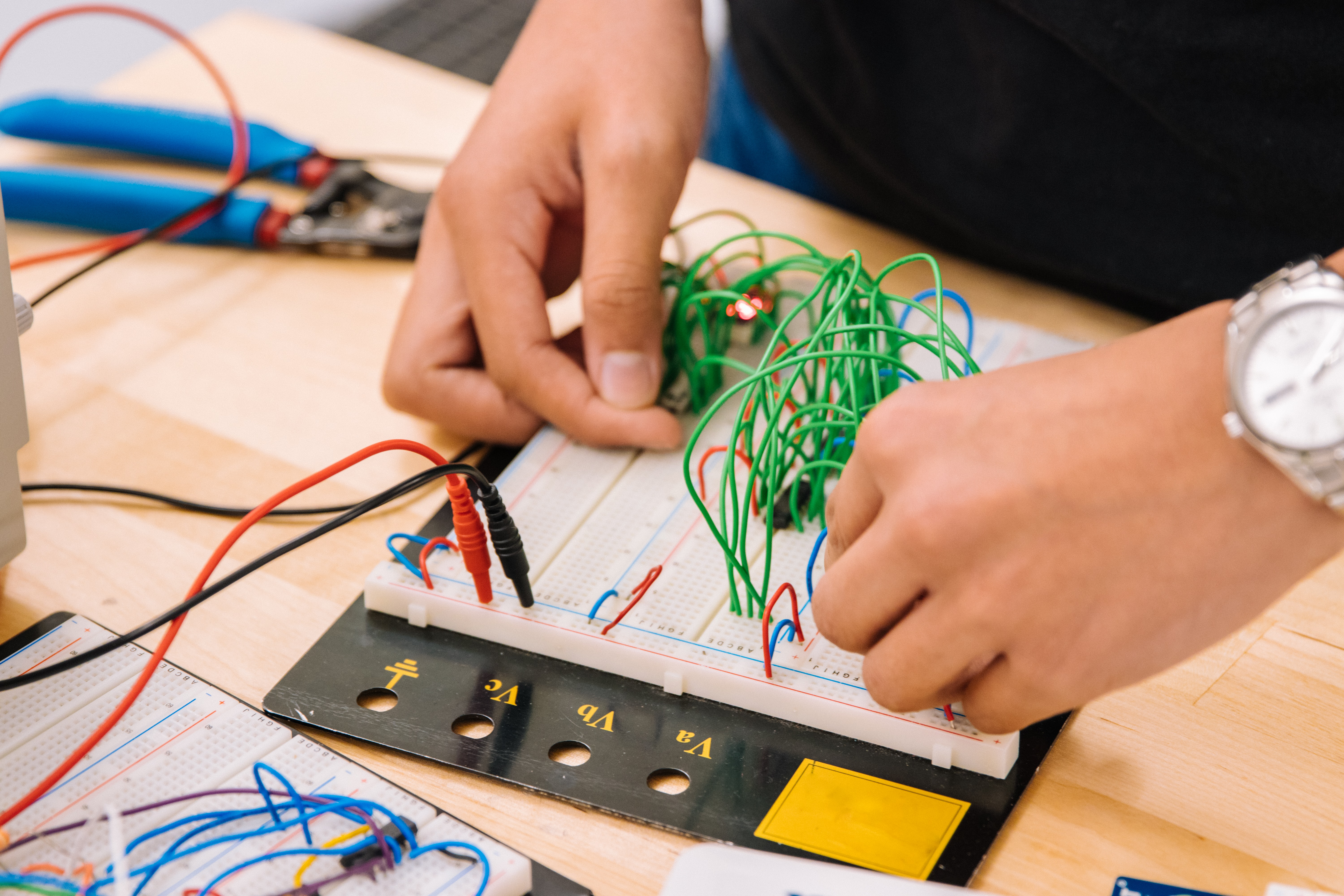 Someone working on a computer board