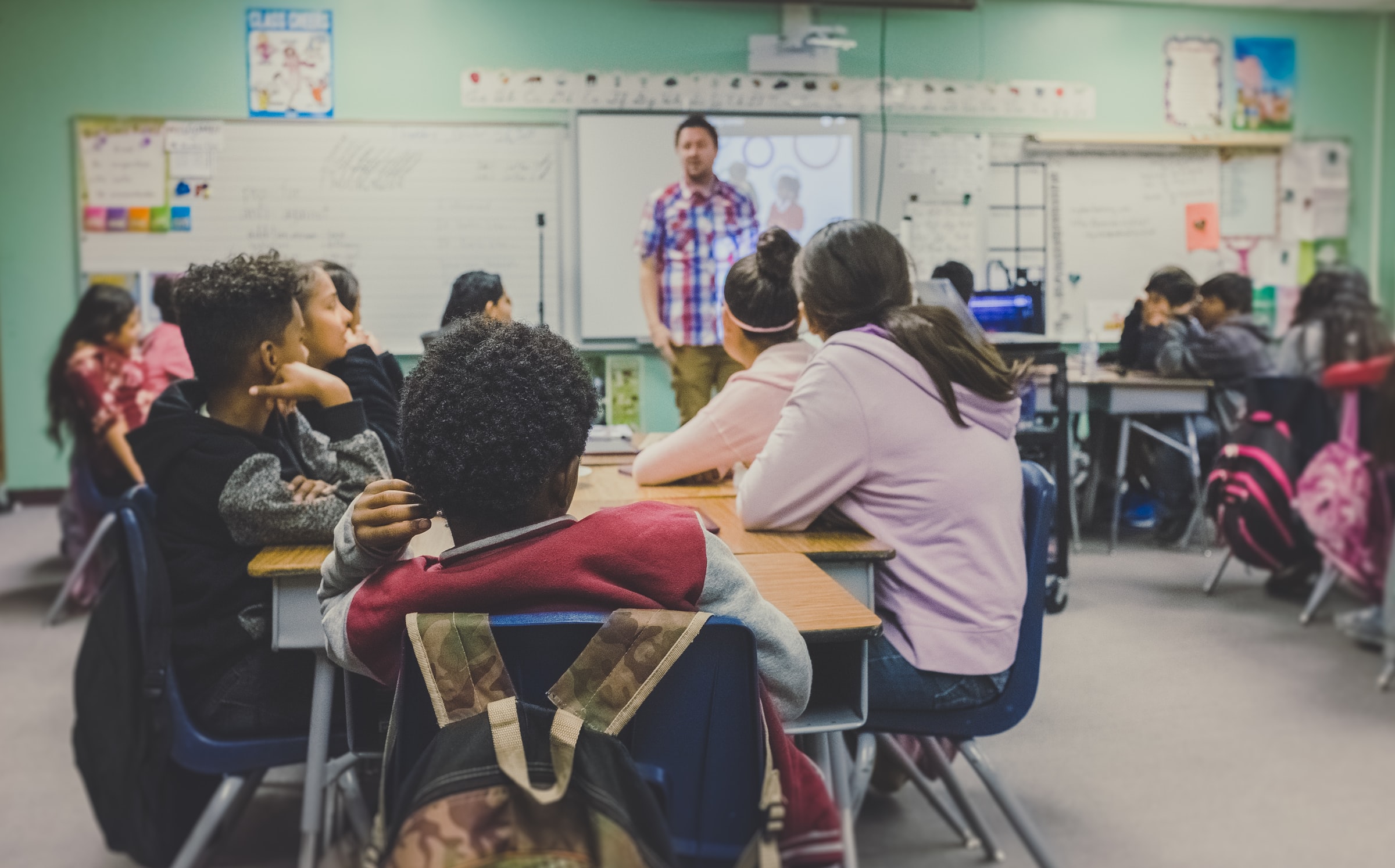 Students and teacher during a classroom lesson.