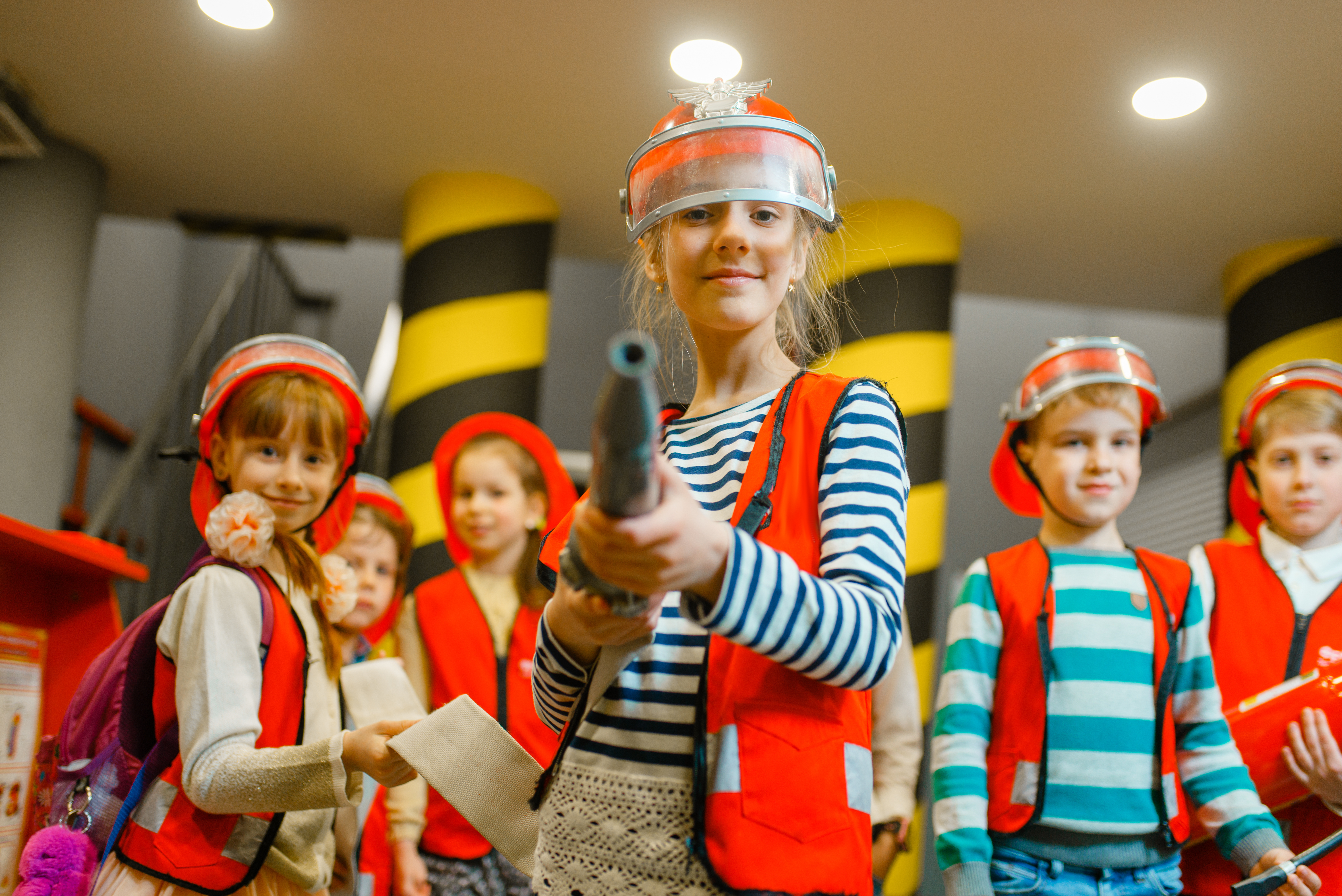 Elementary students dressed up as firefighters