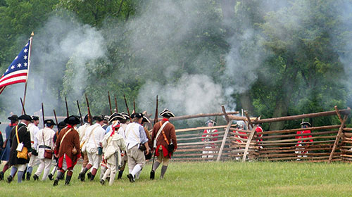 Re-enactor soldiers of the American revolution on a battle field