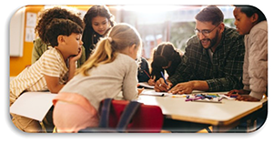 Group of students working at a table with a teacher