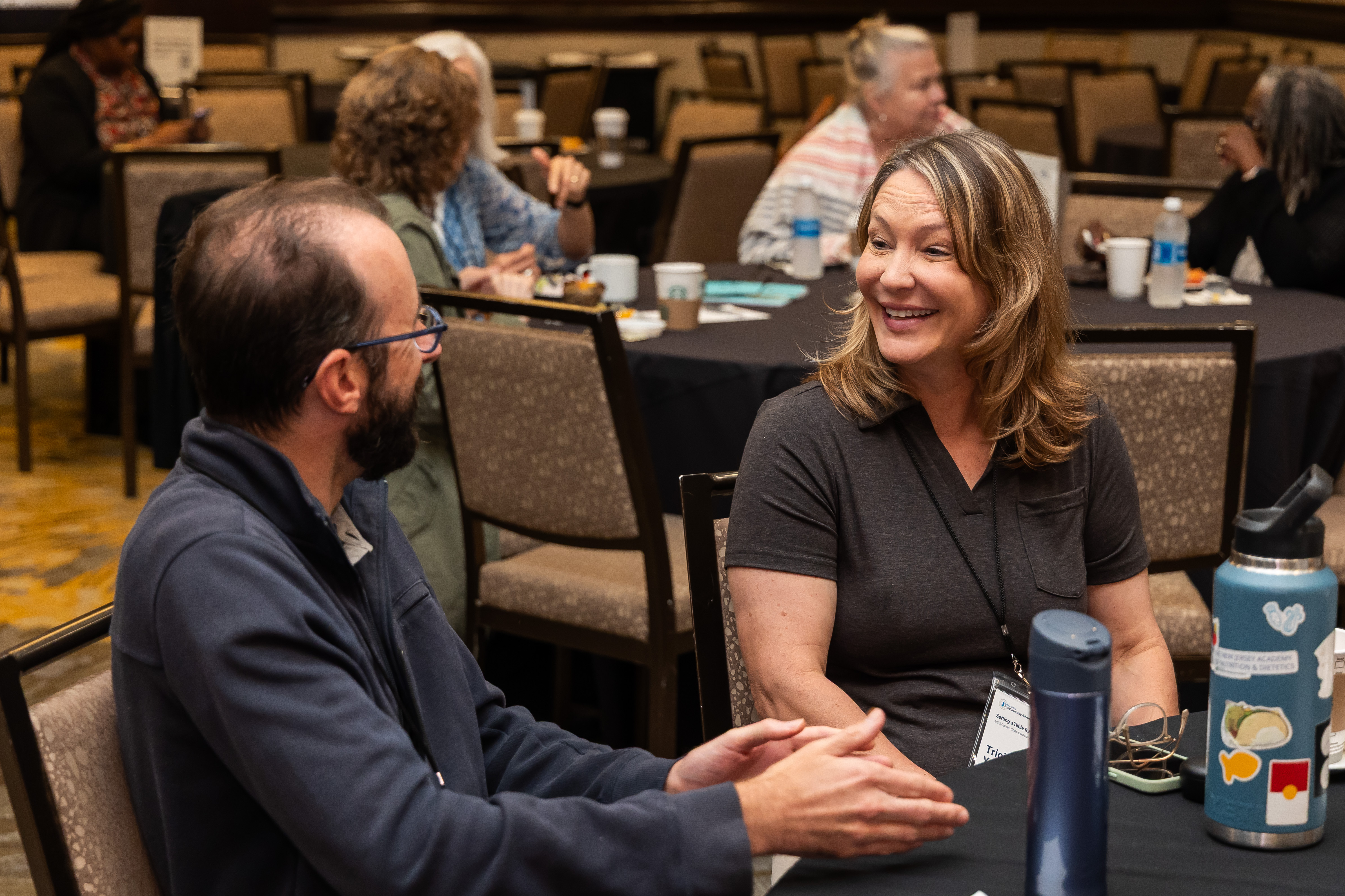 people talking at event