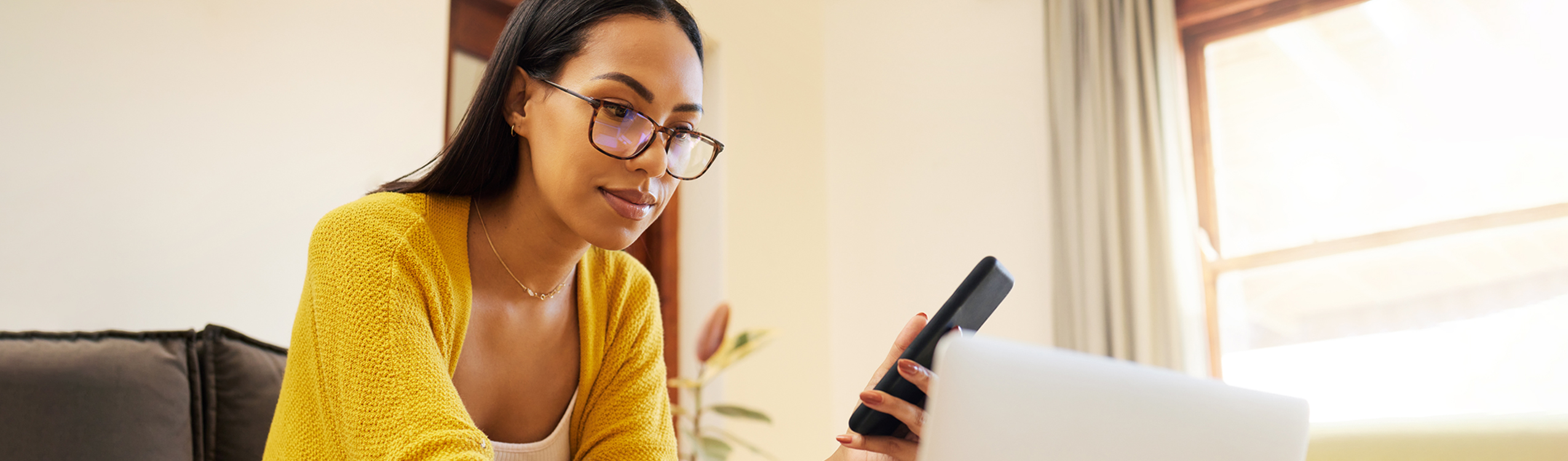 photo: woman looking at cell phone